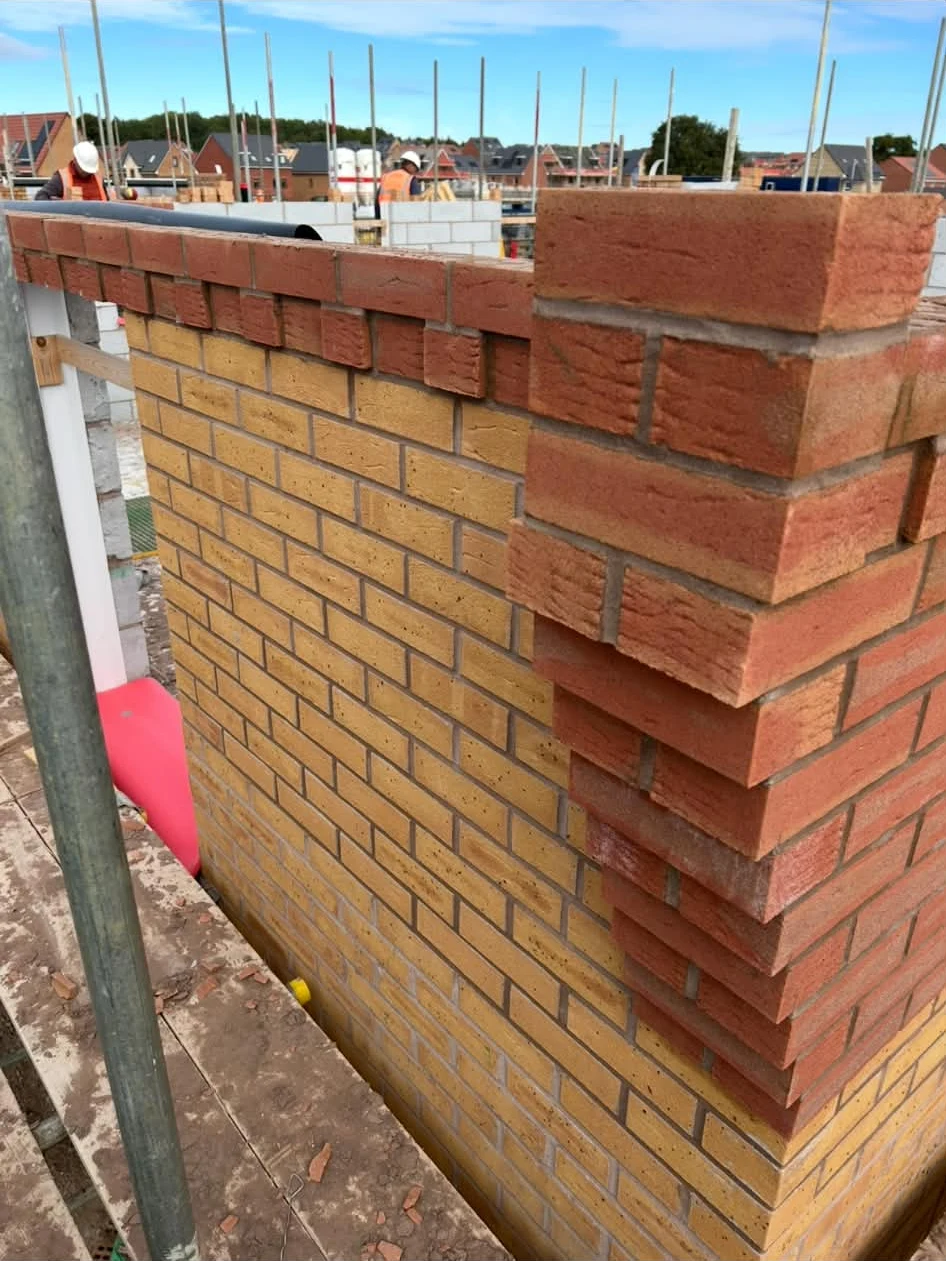Contrasting brickwork with decorative projecting courses